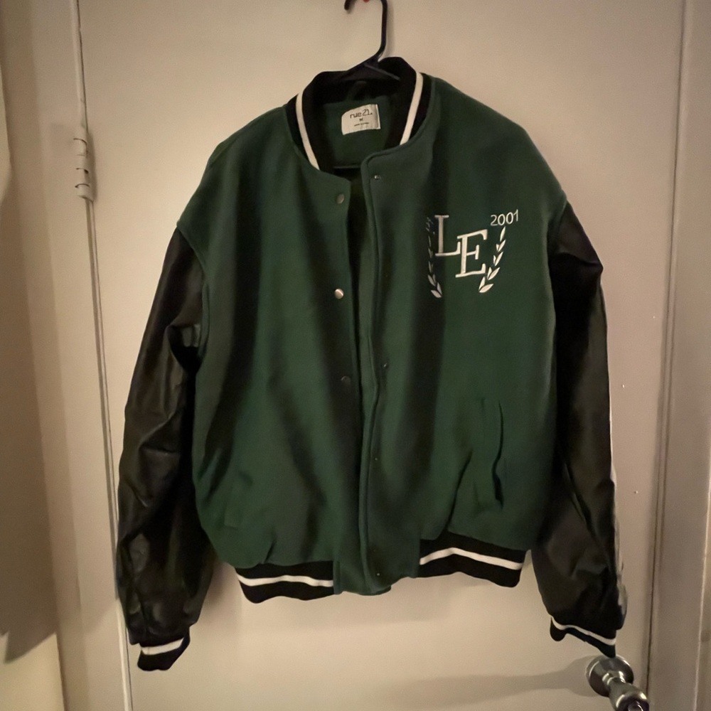 Green and black letterman style jacket, « Limited Edition » across the back.